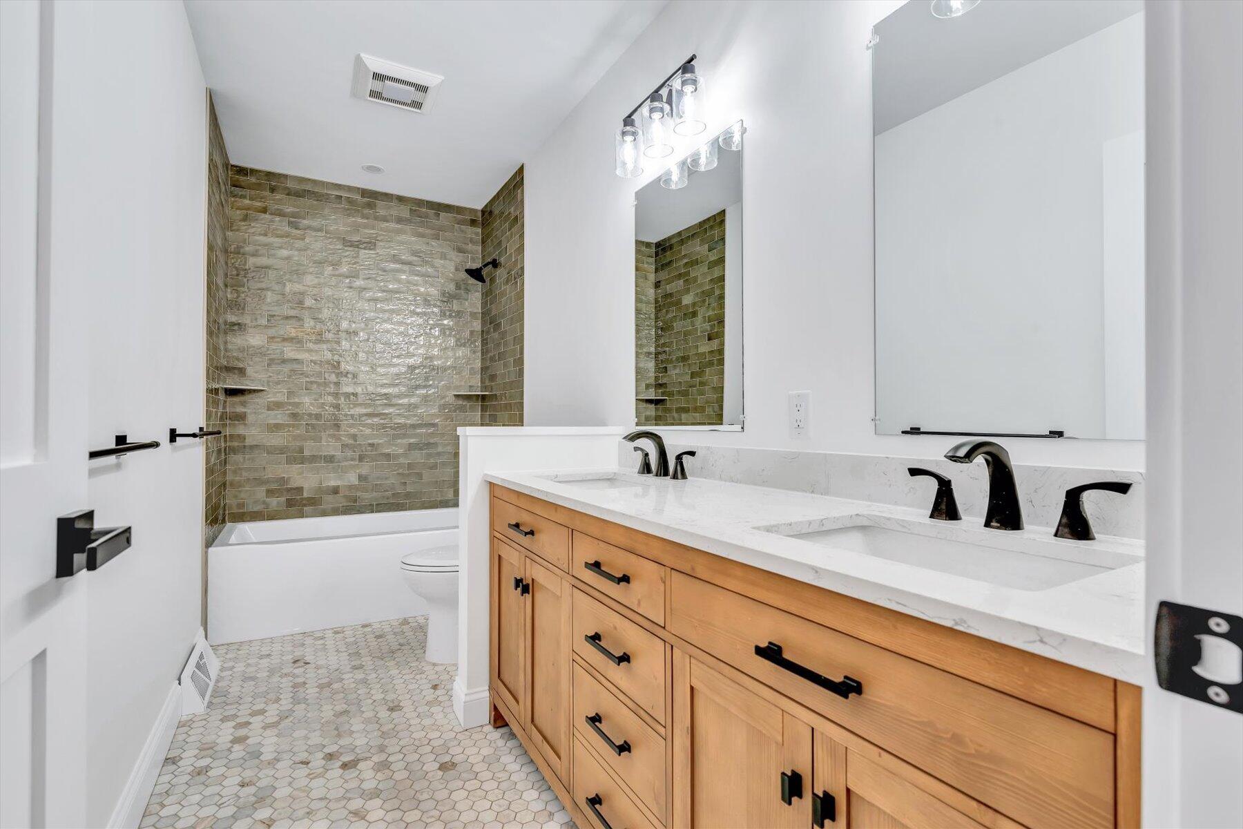 40 Sachem Drive Centerville, MA 02632 - Photo 47 of 56 a bathroom with a tub sink and mirror