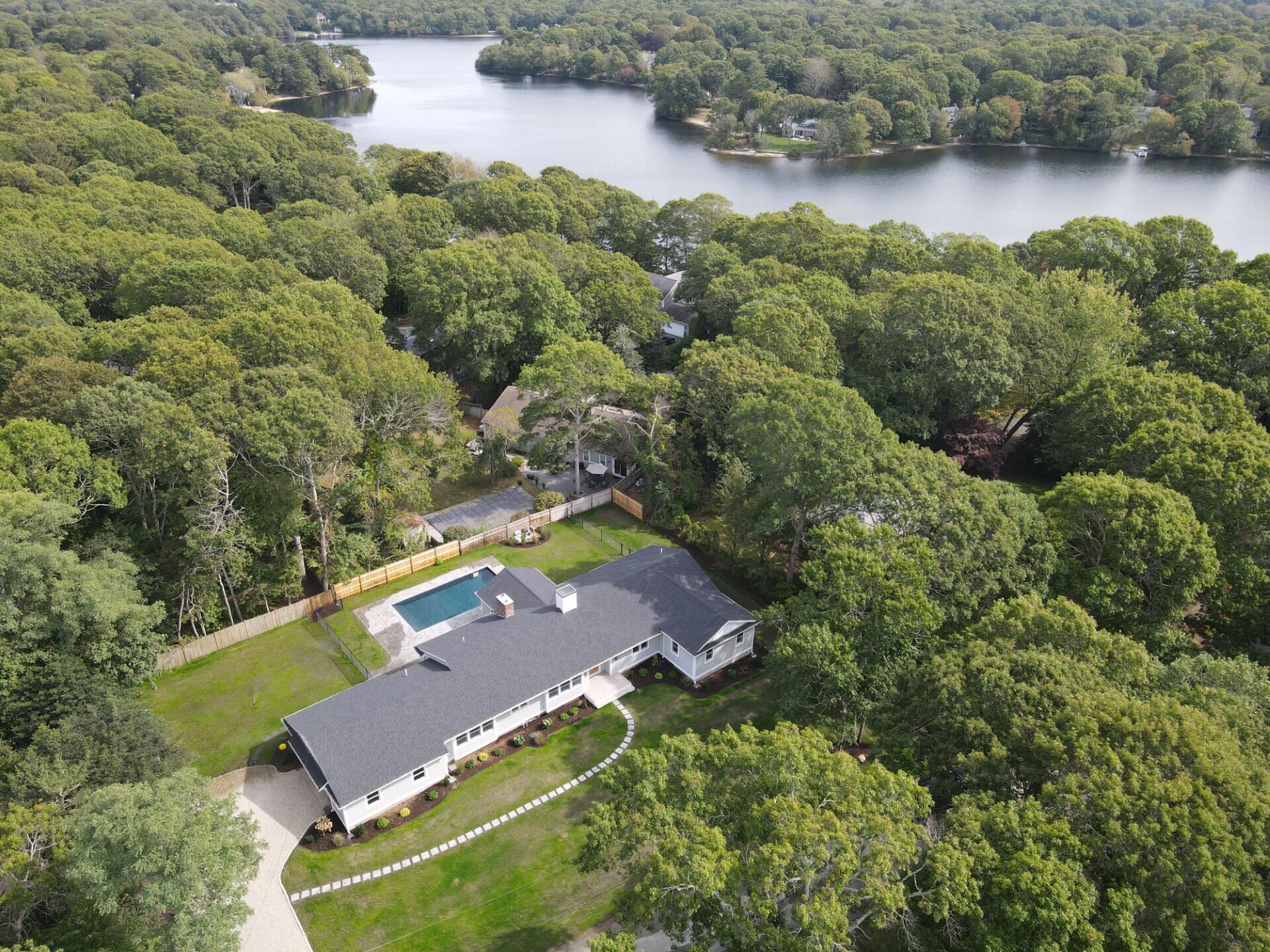 40 Sachem Drive Centerville, MA 02632 - Photo 5 of 56 an aerial view of a house with a lake view