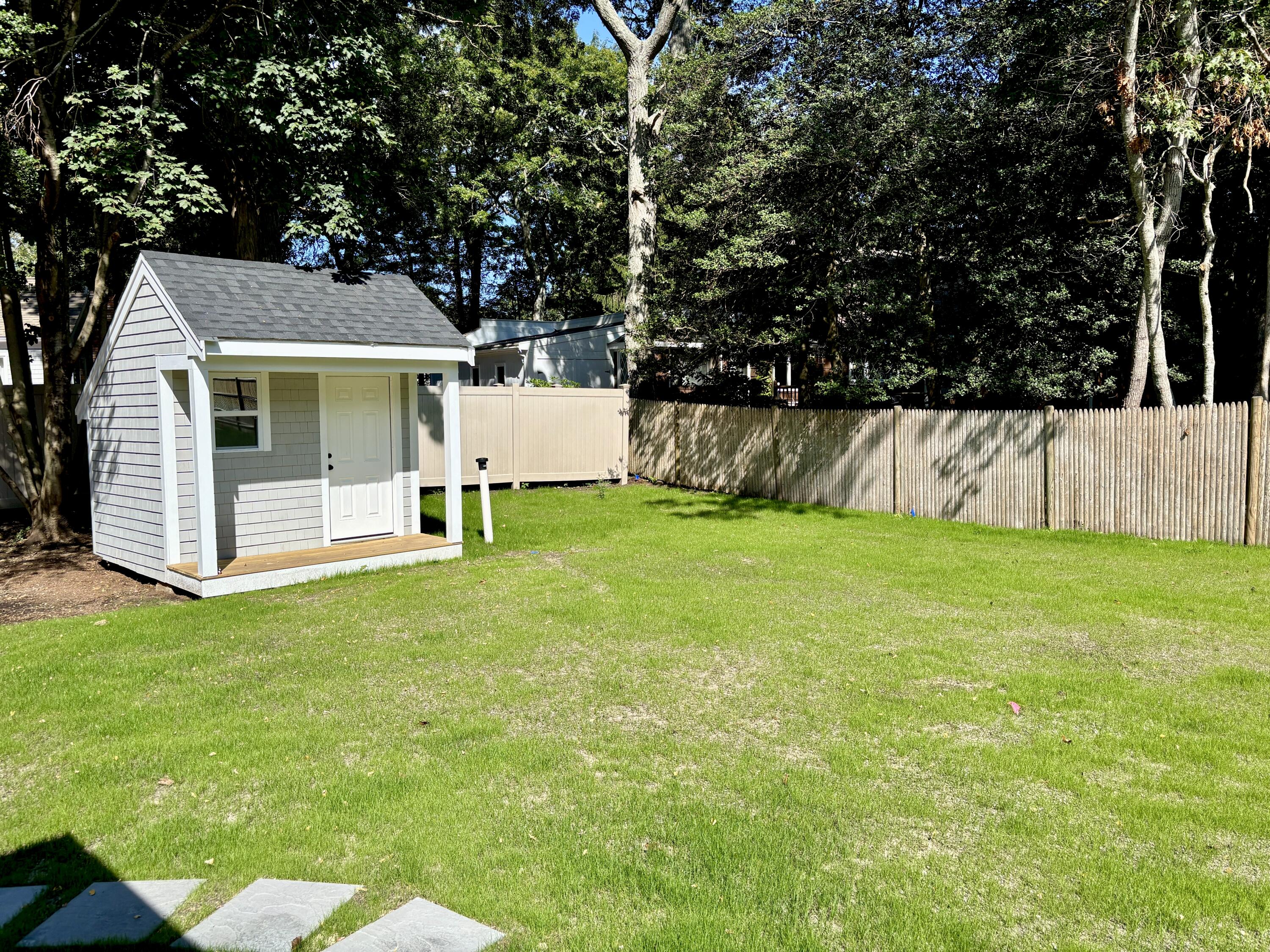 40 Sachem Drive Centerville, MA 02632 - Photo 8 of 56 a view of a house with a yard