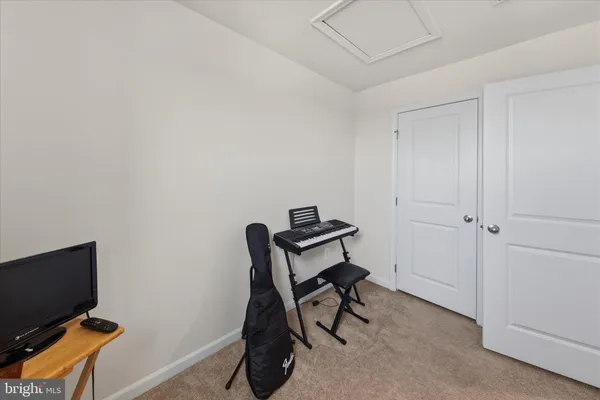 a room with furniture and a flat screen tv