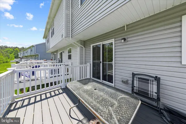 a view of a balcony with a barbeque