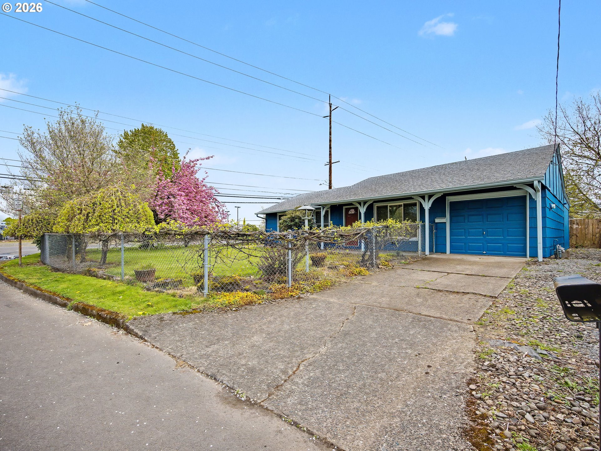 a view of a house with entertaining space and a car parked in front of it