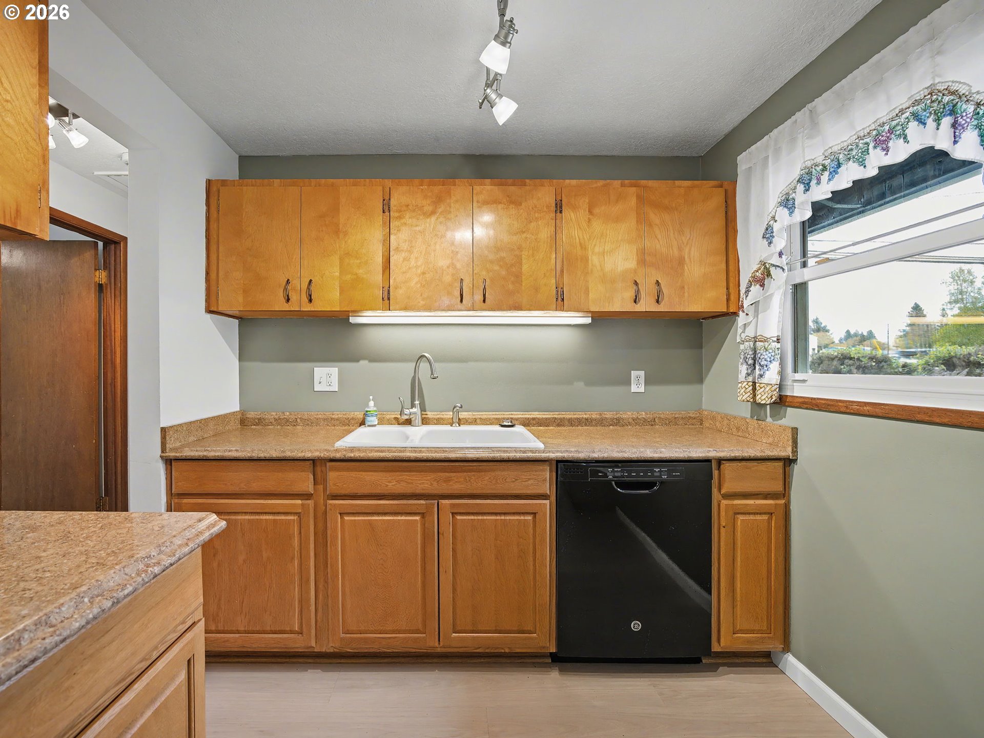 1780 Southeast 2nd Place Gresham, OR 97080 - Photo 12 of 25 a kitchen with a sink stove and cabinets