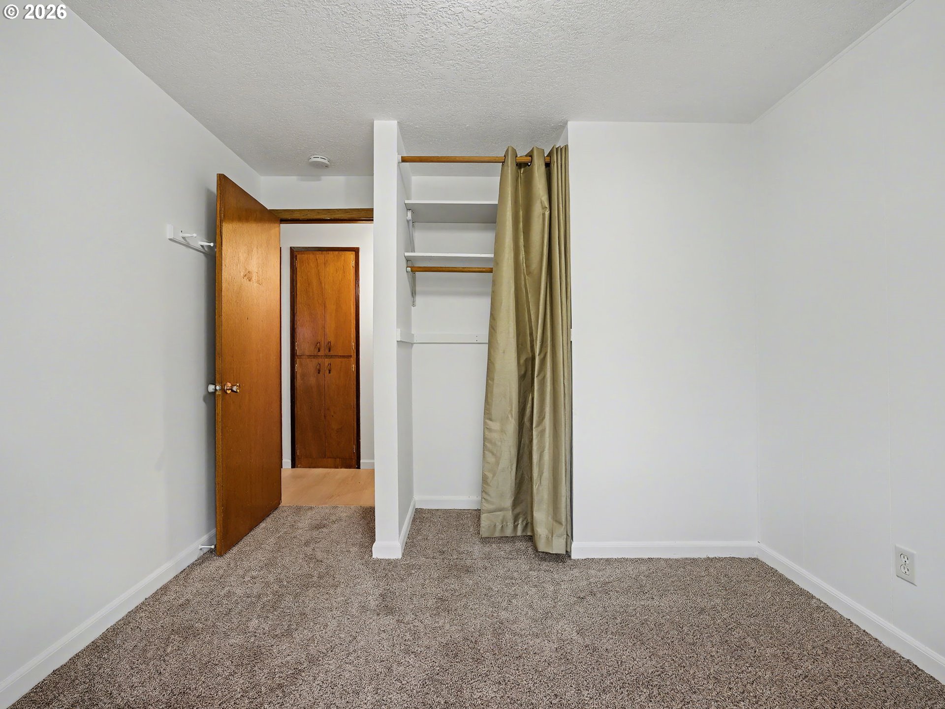 1780 Southeast 2nd Place Gresham, OR 97080 - Photo 17 of 25 an empty room with closet and wooden floor