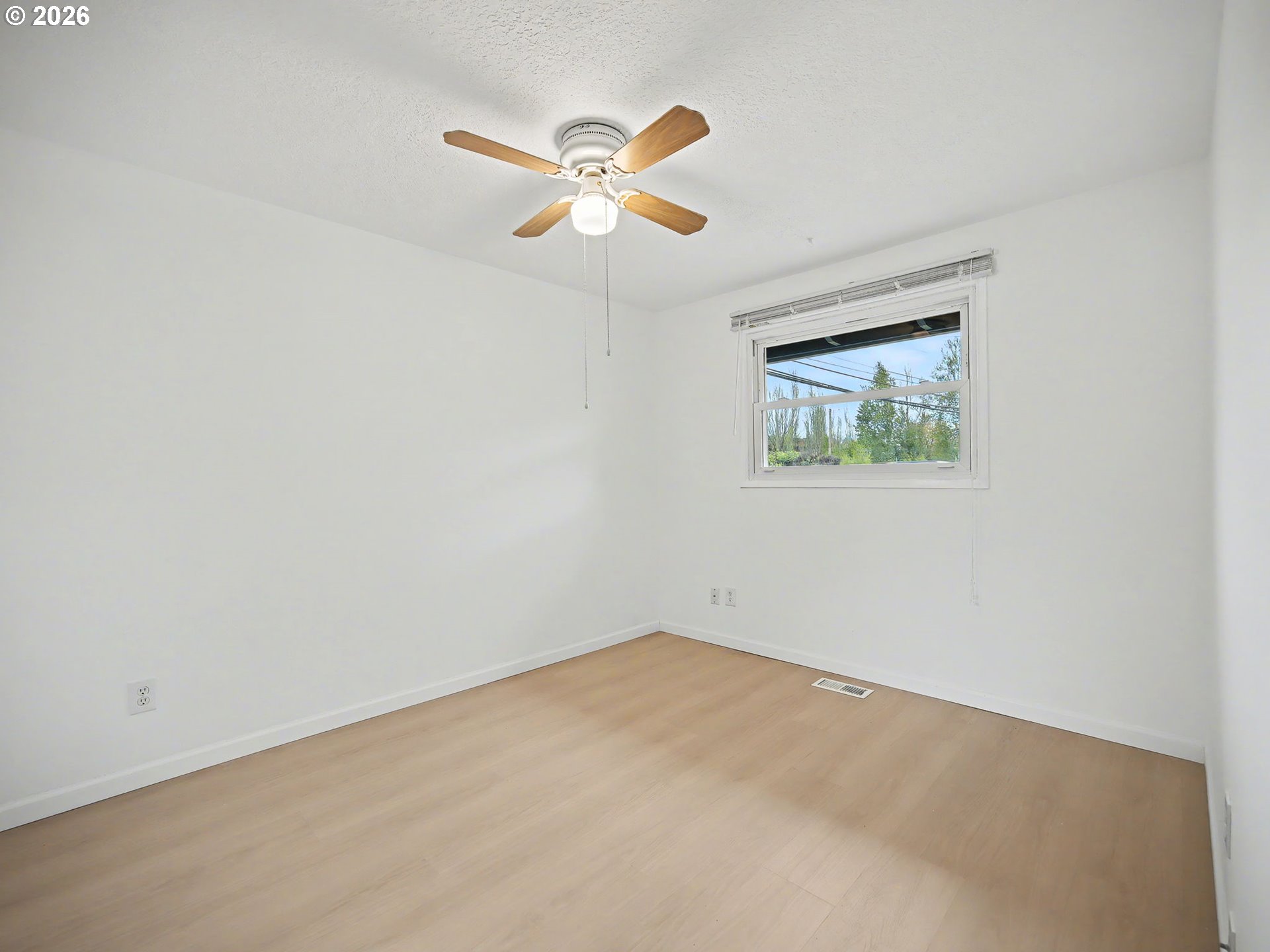 1780 Southeast 2nd Place Gresham, OR 97080 - Photo 18 of 25 an empty room with a window and a fan
