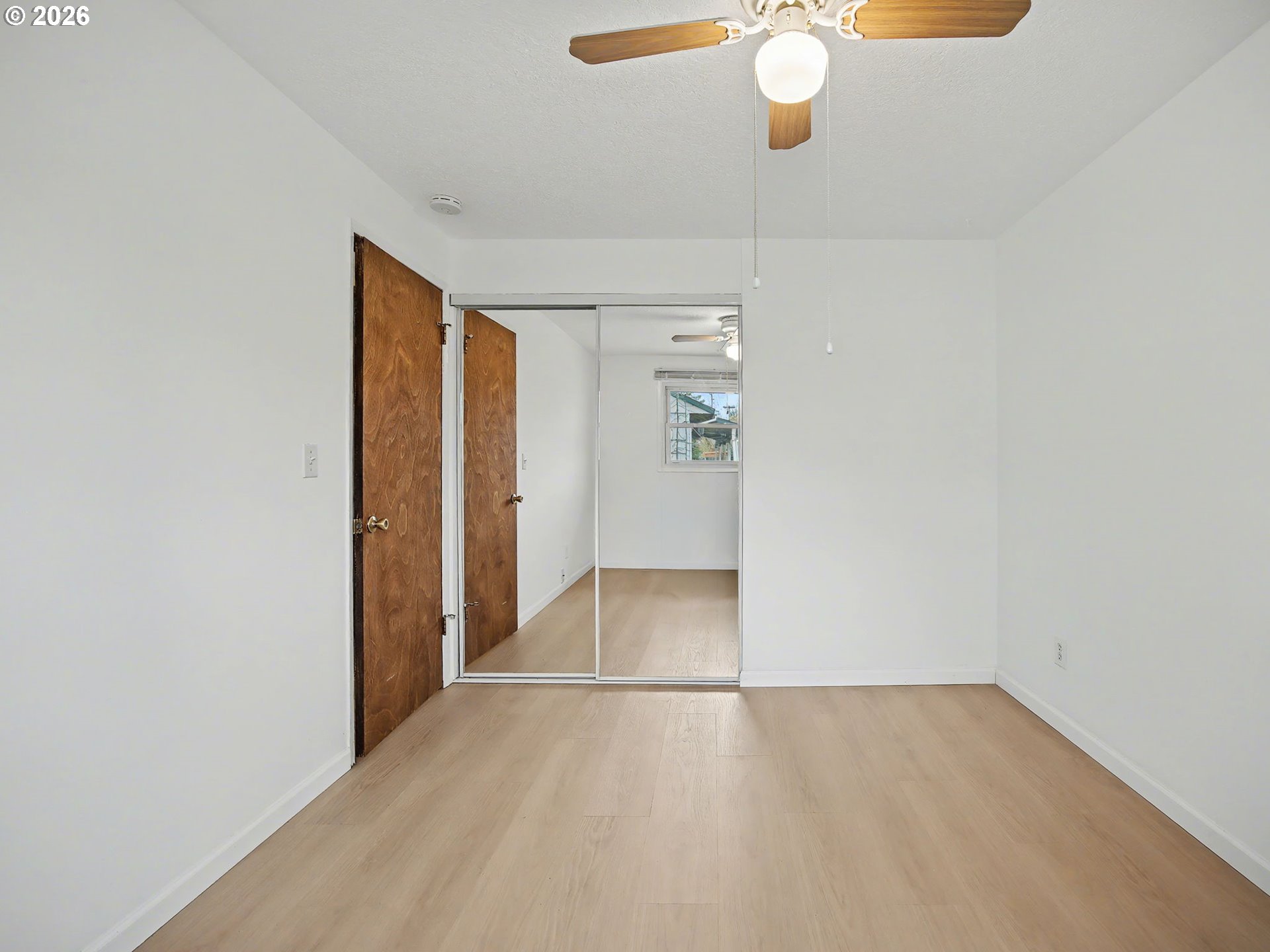 1780 Southeast 2nd Place Gresham, OR 97080 - Photo 20 of 25 wooden floor in an empty room with a window