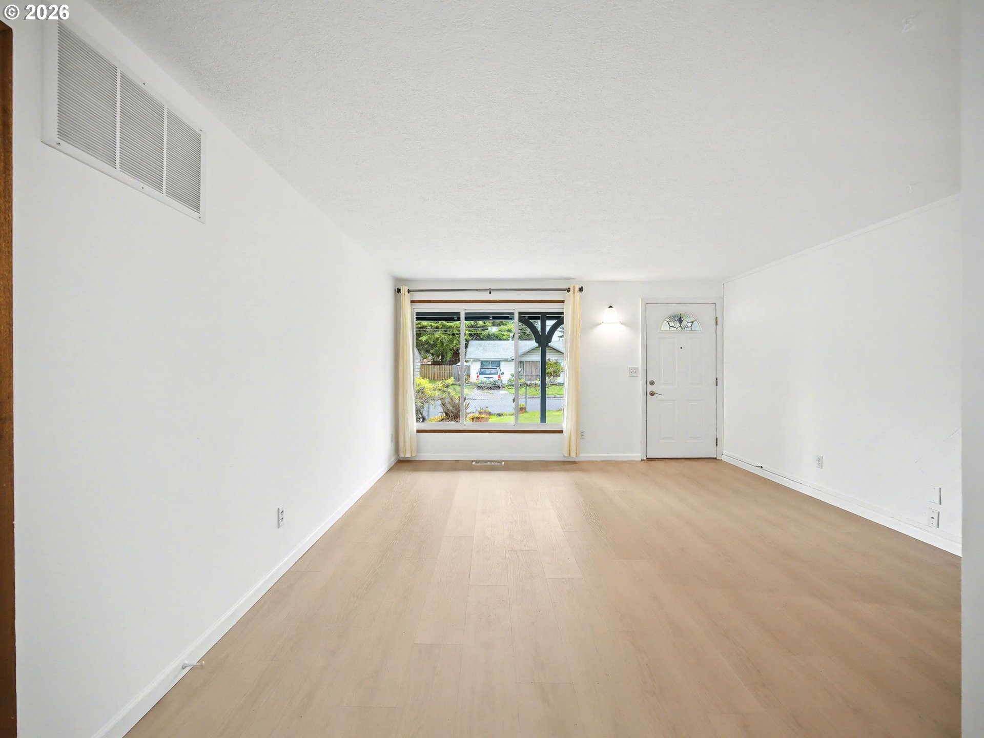1780 Southeast 2nd Place Gresham, OR 97080 - Photo 6 of 25 an empty room with windows