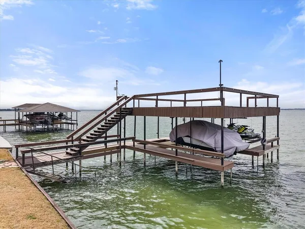a swimming pool with outdoor seating and yard