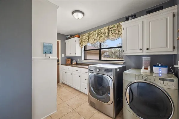 a view of a kitchen with washer and dryer