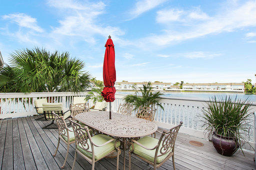 814 Ocean Dunes Circle Jupiter, FL 33477 - Photo 2 of 34 a view of a chairs and table on the roof deck