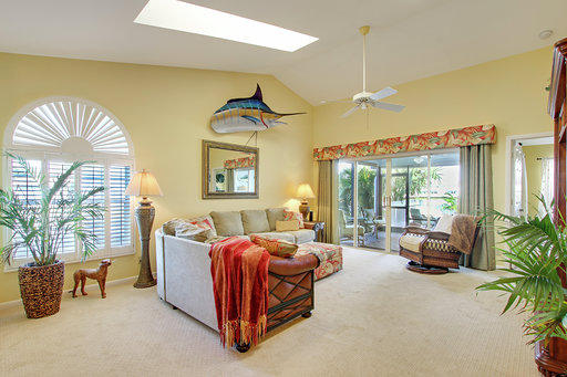 814 Ocean Dunes Circle Jupiter, FL 33477 - Photo 24 of 34 a bedroom with furniture and large windows