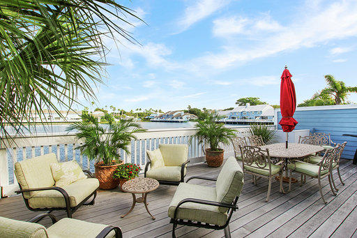 814 Ocean Dunes Circle Jupiter, FL 33477 - Photo 3 of 34 a view of a chairs and table in patio