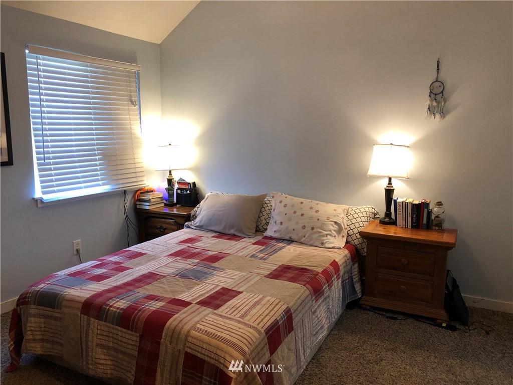 2314 Cherry Road Lake Stevens, WA 98258 - Photo 14 of 32 a bedroom with a bed a lamp and window