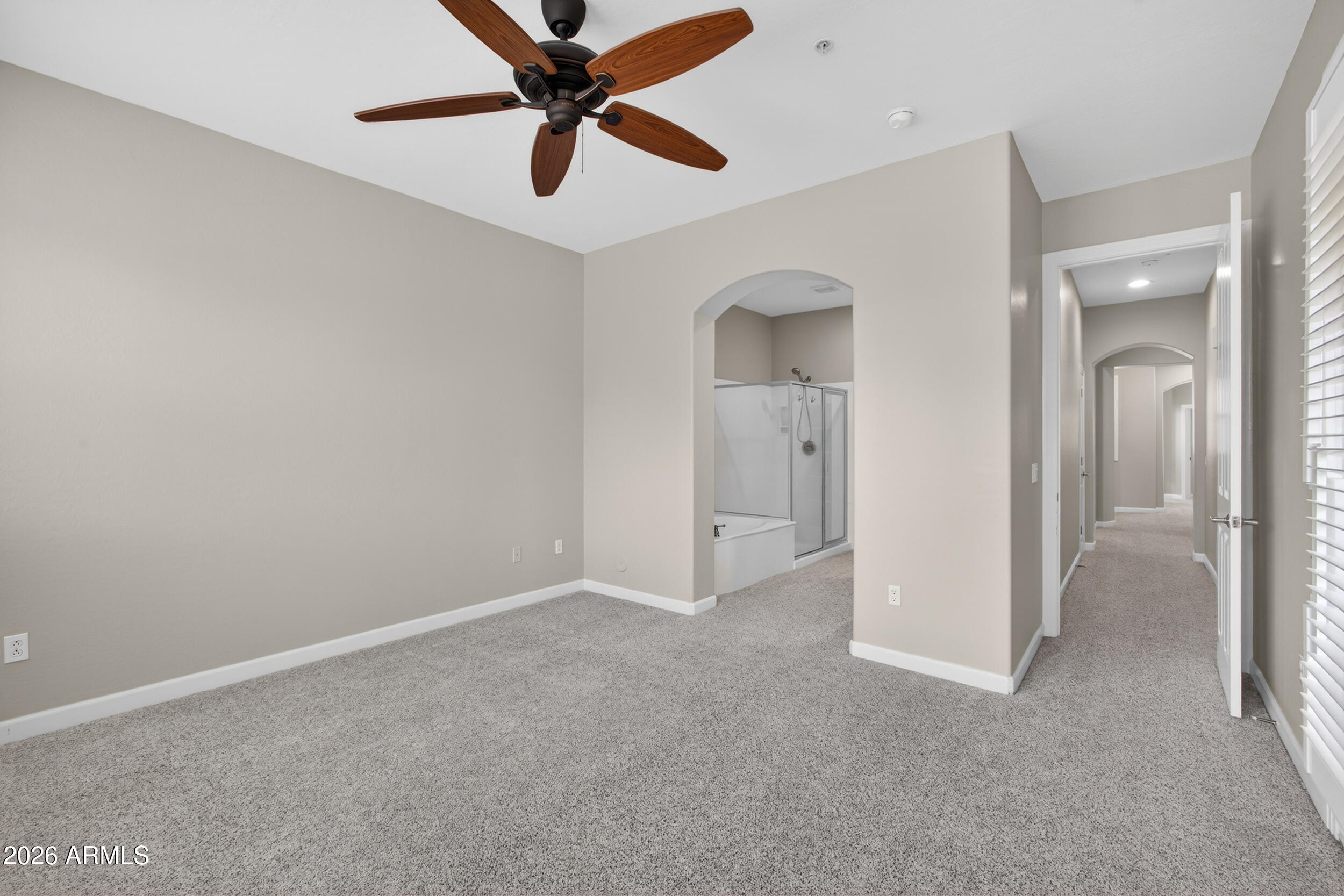 4777 South Fulton Ranch Boulevard, Unit 2044 Chandler, AZ 85248 - Photo 16 of 46 an empty room with closet and a chandelier fan