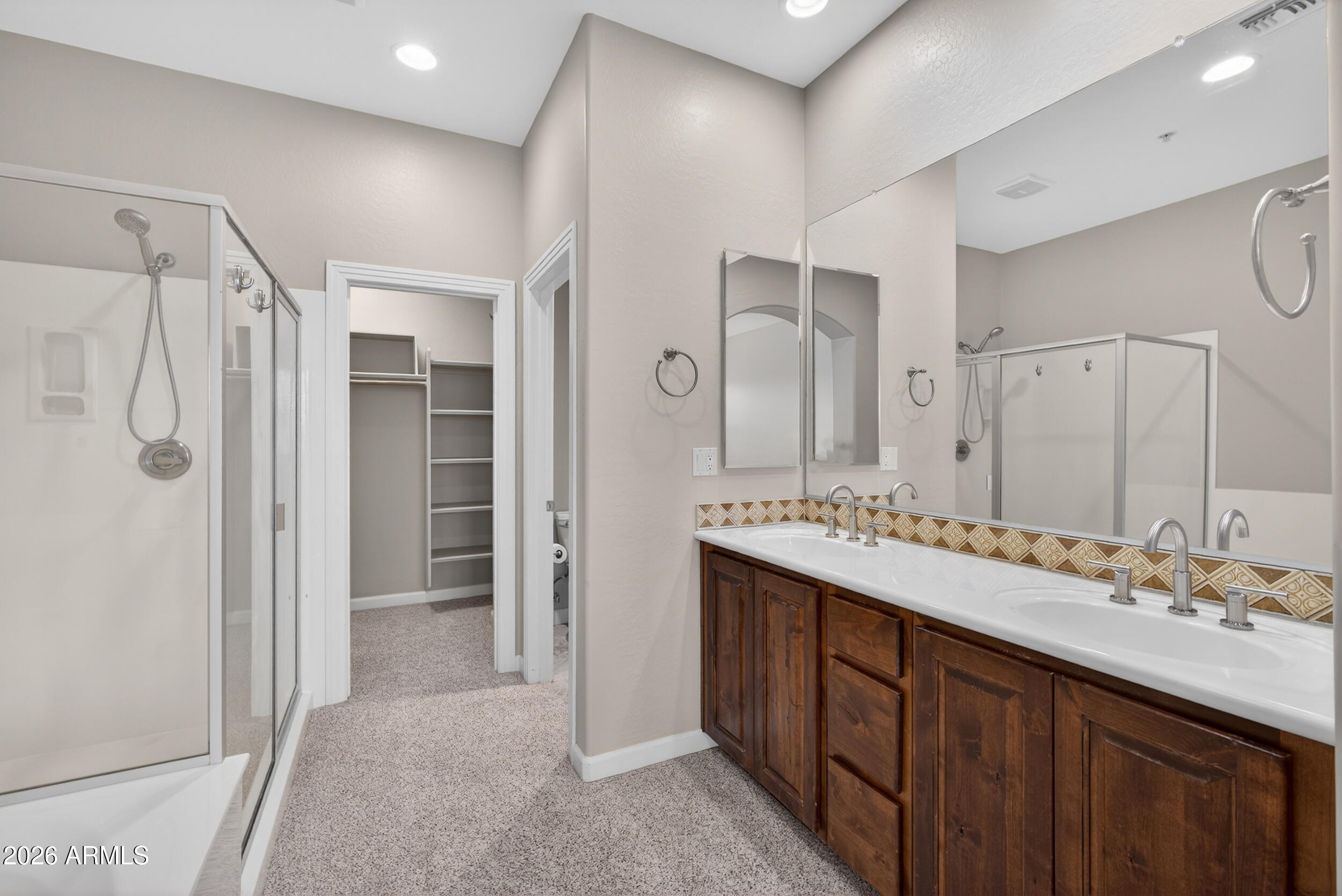 4777 South Fulton Ranch Boulevard, Unit 2044 Chandler, AZ 85248 - Photo 18 of 46 a bathroom with a double vanity sink mirror double and shower