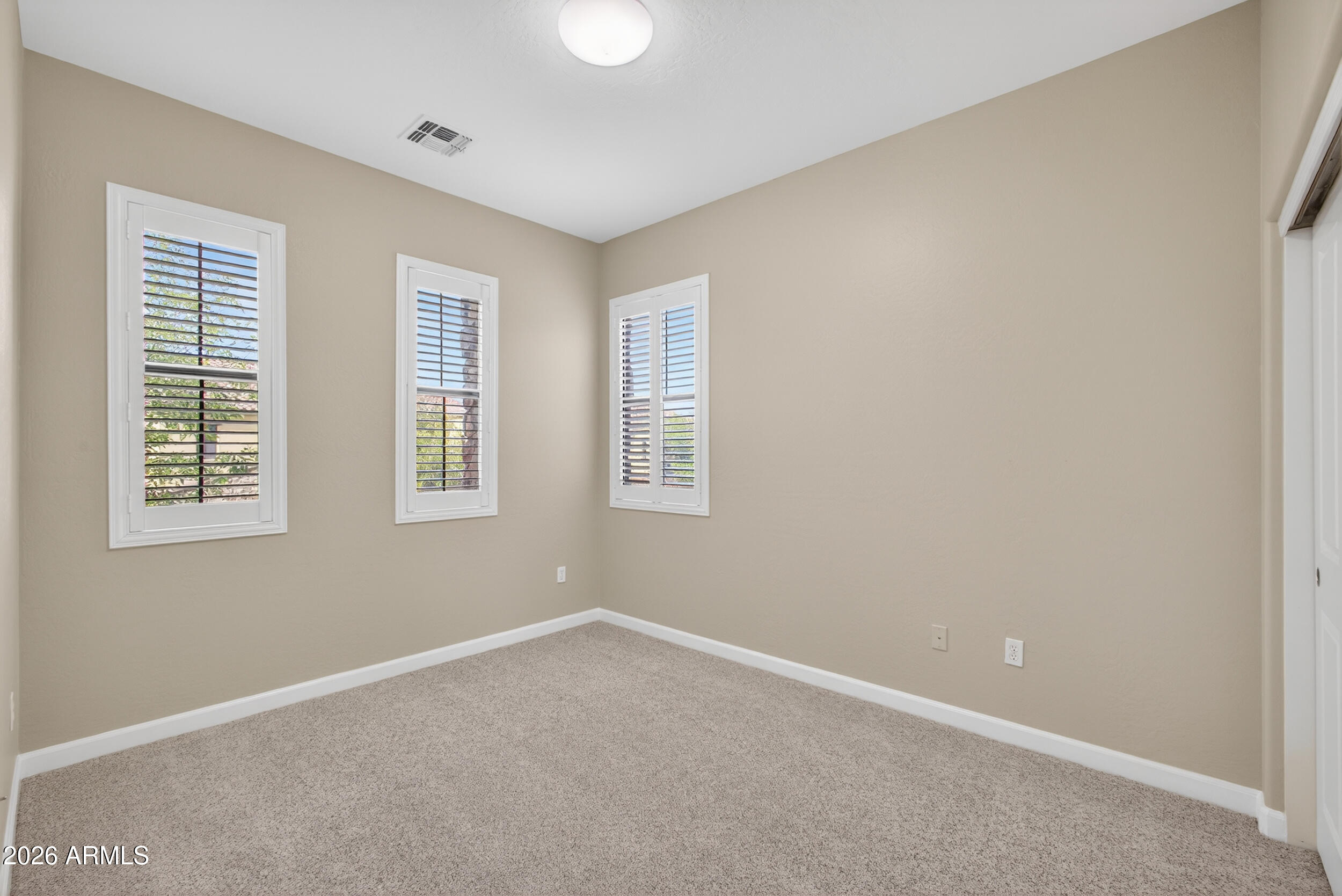 4777 South Fulton Ranch Boulevard, Unit 2044 Chandler, AZ 85248 - Photo 23 of 46 an empty room with windows