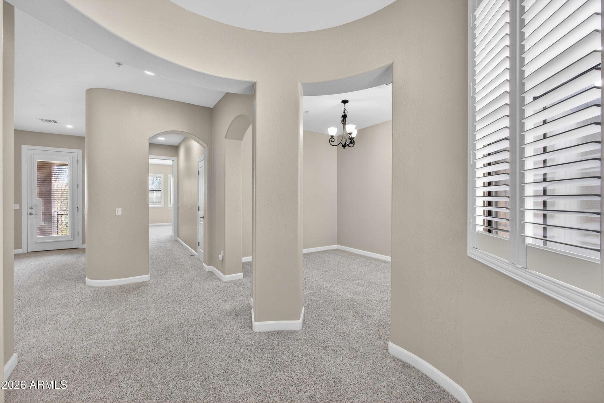 4777 South Fulton Ranch Boulevard, Unit 2044 Chandler, AZ 85248 - Photo 27 of 46 an empty room with windows and entrance