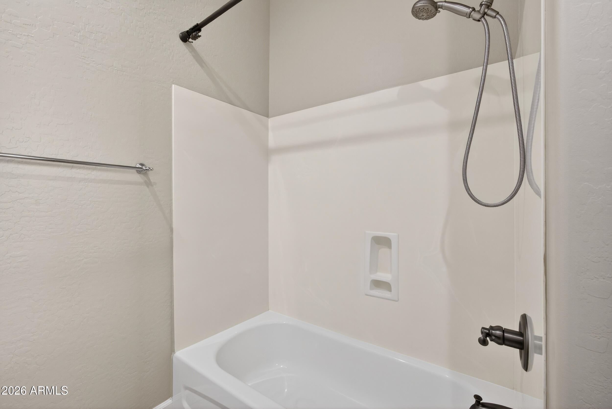 4777 South Fulton Ranch Boulevard, Unit 2044 Chandler, AZ 85248 - Photo 32 of 46 a bathroom with a white bath tub and a shower