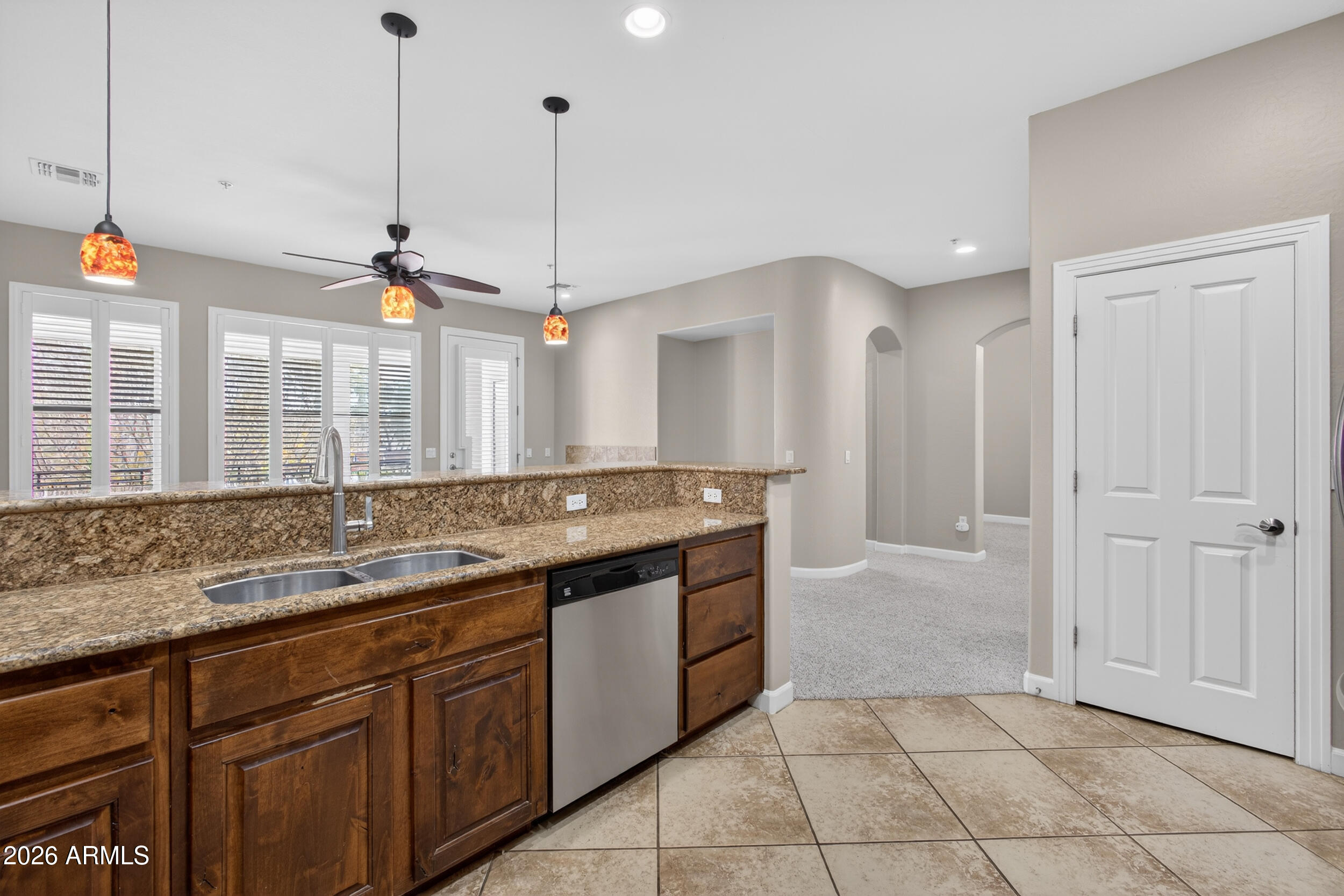 4777 South Fulton Ranch Boulevard, Unit 2044 Chandler, AZ 85248 - Photo 9 of 46 a bathroom with a granite countertop sink and a mirror