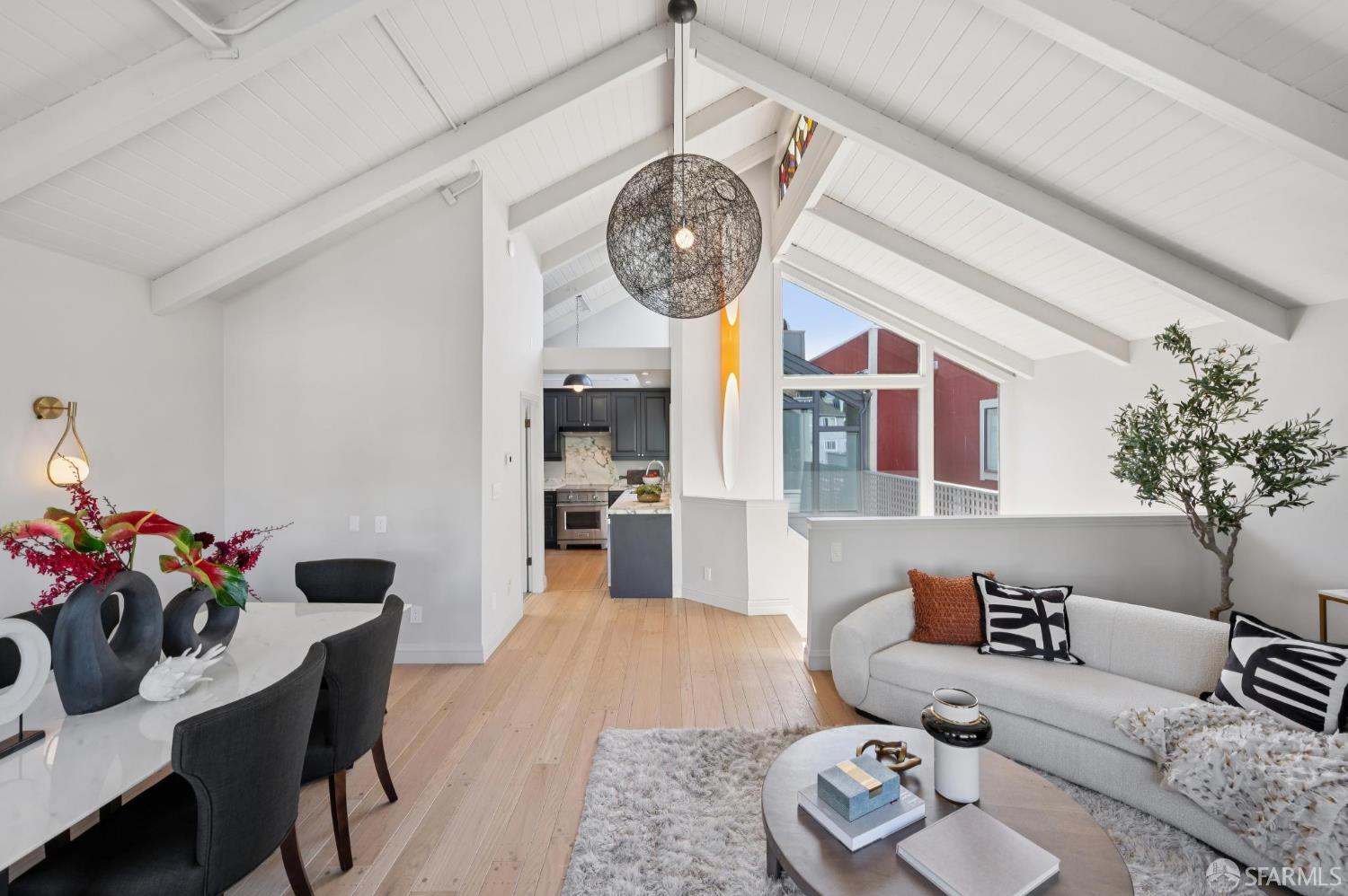 2023 22nd Street San Francisco, CA 94107 - Photo 14 of 56 a living room with furniture a clock and a chandelier