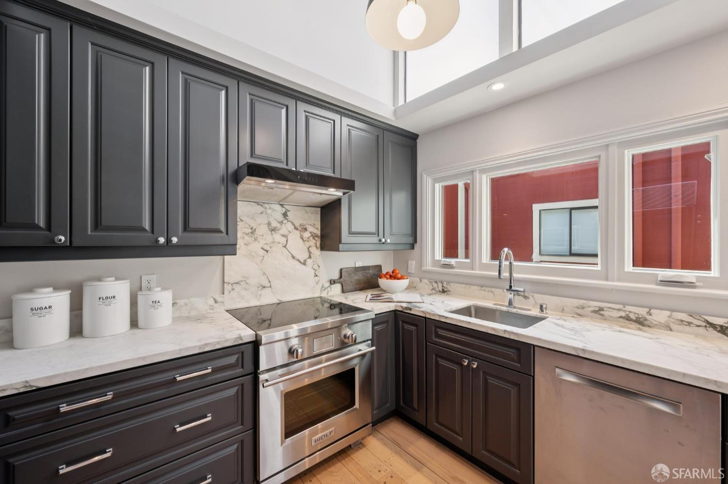 2023 22nd Street San Francisco, CA 94107 - Photo 17 of 56 a kitchen with stainless steel appliances granite countertop a sink stove and cabinets