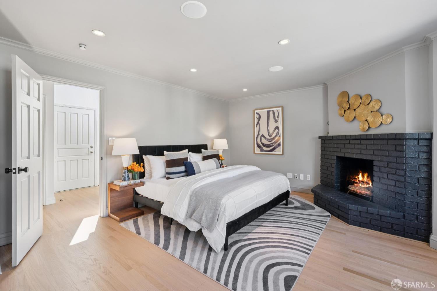 2023 22nd Street San Francisco, CA 94107 - Photo 23 of 56 a bed room with a bed and a fireplace
