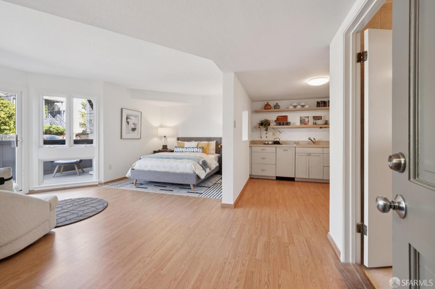 2023 22nd Street San Francisco, CA 94107 - Photo 40 of 56 a bedroom with furniture and a wooden floor