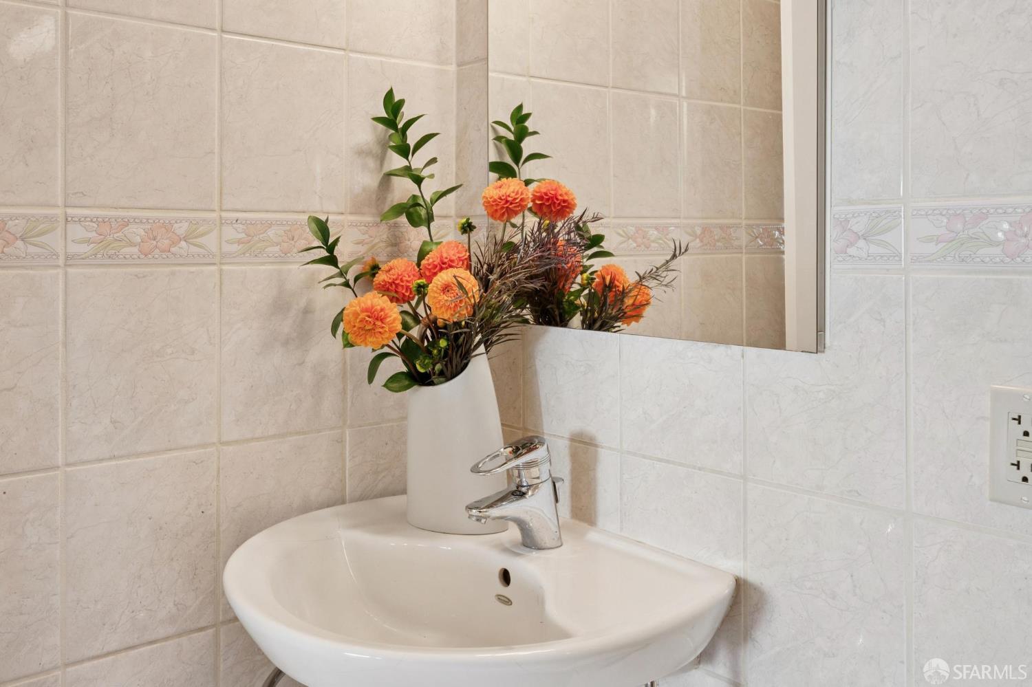 2023 22nd Street San Francisco, CA 94107 - Photo 50 of 56 a bathroom with a sink a mirror and vanity