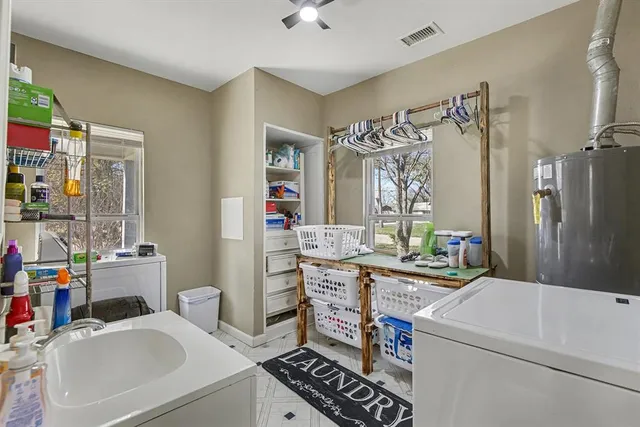 a bathroom with a sink vanity mirror and toilet