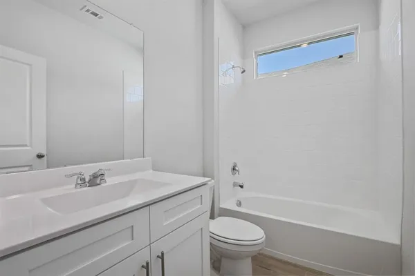 a bathroom with a sink toilet and a bathtub