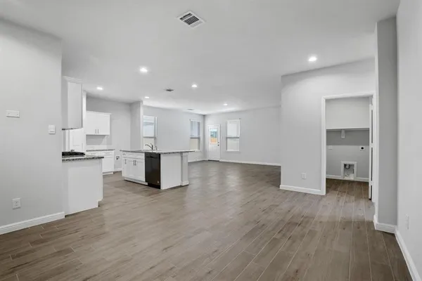 a view of kitchen with wooden floor