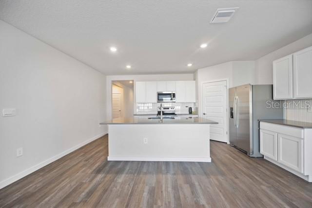 3703 Hatchery Way Lakewood Ranch, FL 34211 - Photo 15 of 35 a view of kitchen with wooden floor