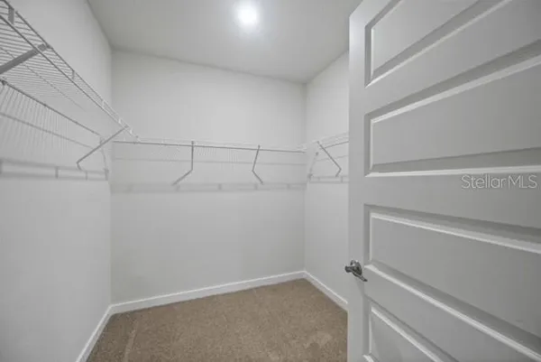 a view of a room with racks on the wall