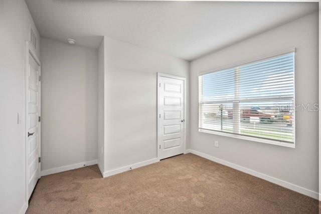 3703 Hatchery Way Lakewood Ranch, FL 34211 - Photo 20 of 35 an empty room with windows