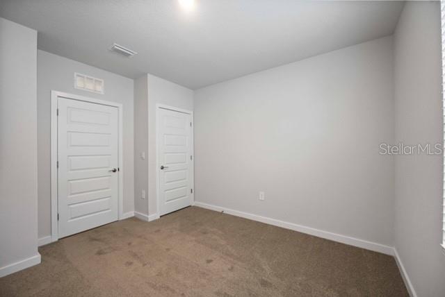 3703 Hatchery Way Lakewood Ranch, FL 34211 - Photo 22 of 35 an empty room with closet area