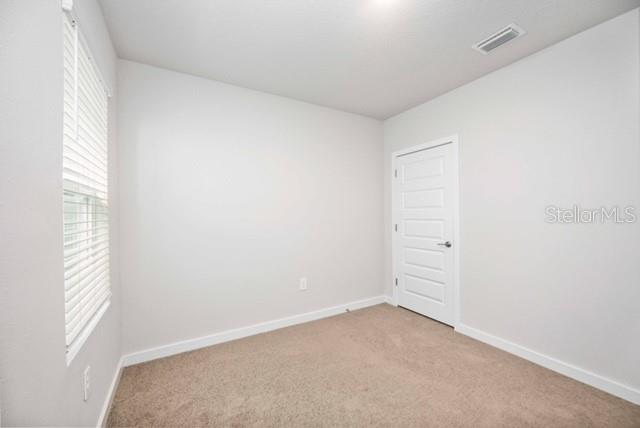 3703 Hatchery Way Lakewood Ranch, FL 34211 - Photo 23 of 35 a view of an empty room and a window