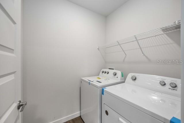 3703 Hatchery Way Lakewood Ranch, FL 34211 - Photo 27 of 35 a utility room with dryer and washer
