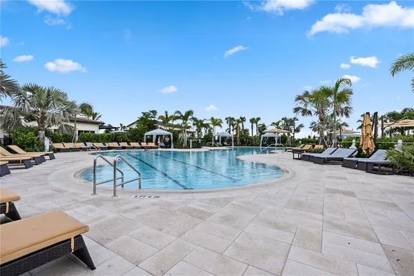 a view of a swimming pool with a lounge chairs