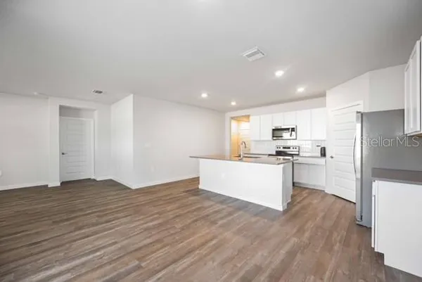 a view of kitchen with wooden floor