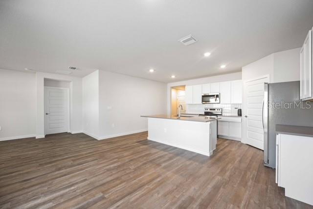 3703 Hatchery Way Lakewood Ranch, FL 34211 - Photo 5 of 35 a view of kitchen with wooden floor