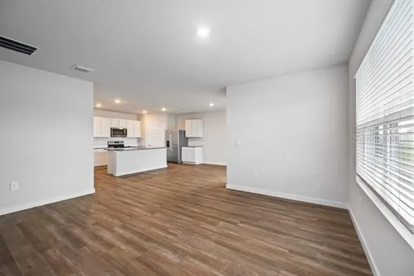 a view of kitchen with wooden floor