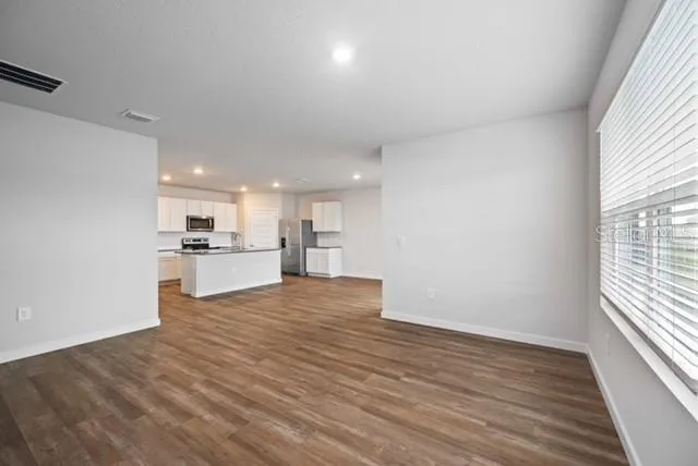 a view of kitchen with wooden floor