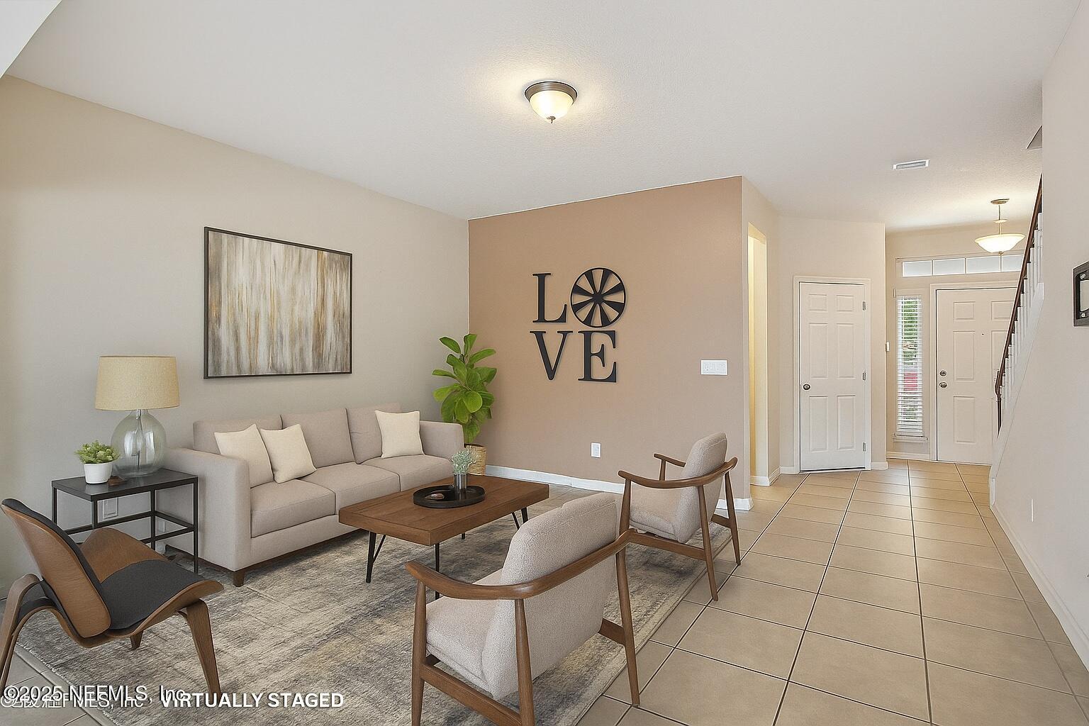 a living room with furniture and a table