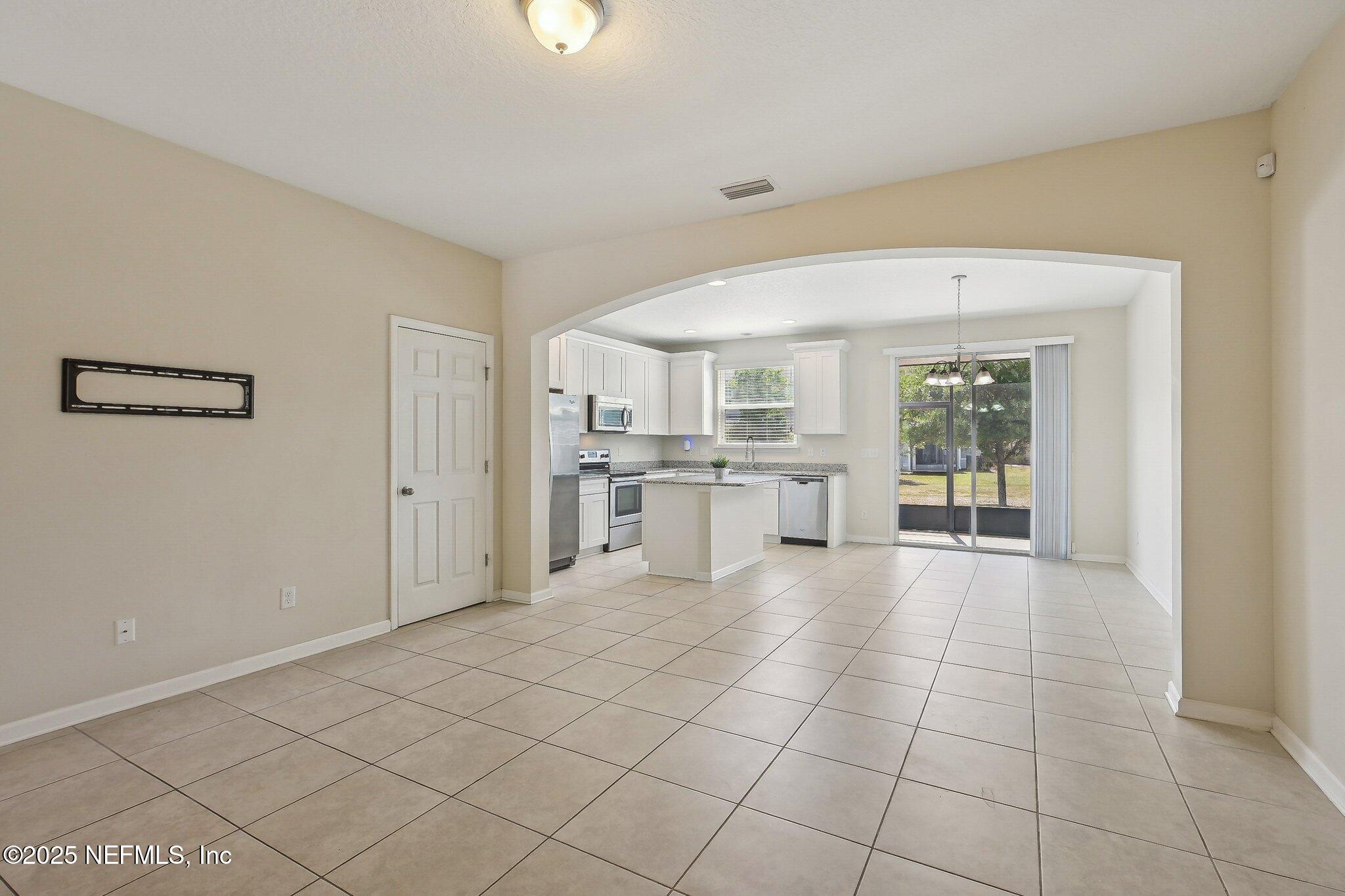 53 Nelson Lane St. Johns, FL 32259 - Photo 12 of 37 a large white kitchen with a sink and refrigerator