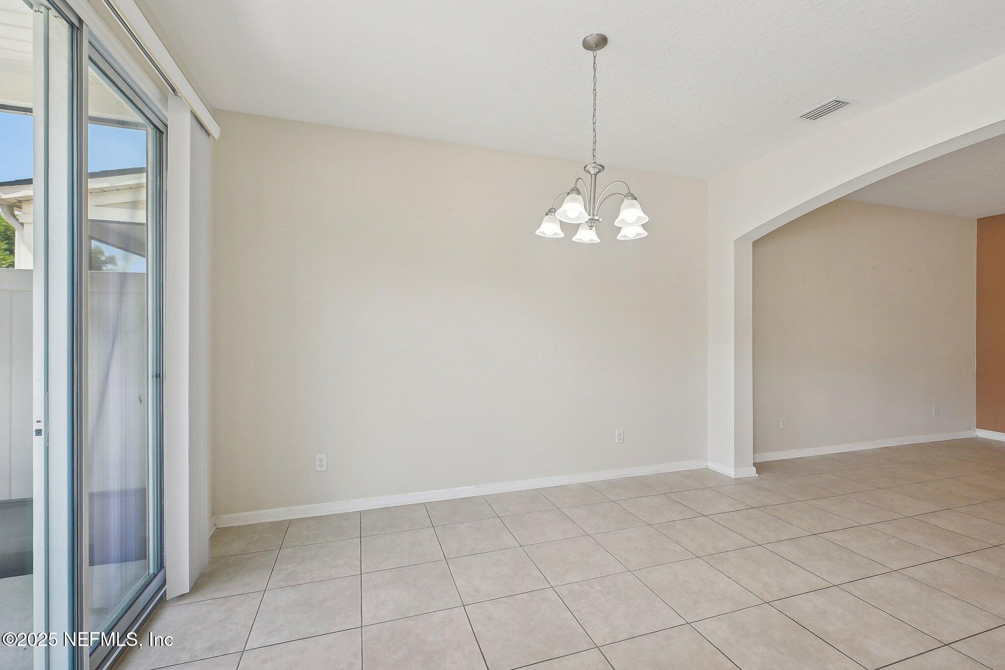 53 Nelson Lane St. Johns, FL 32259 - Photo 13 of 37 a view of a chandelier in big room and chandelier fan