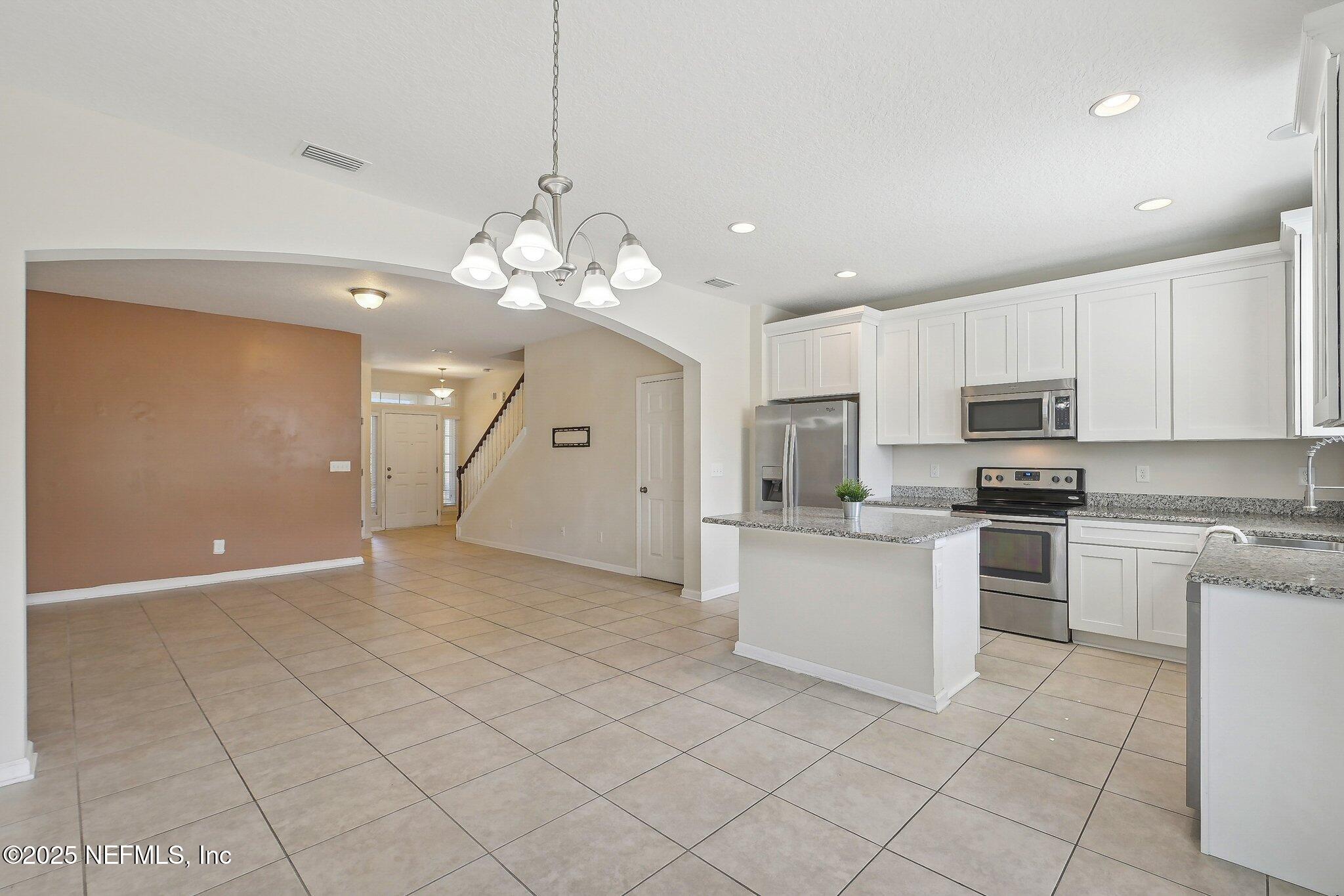 53 Nelson Lane St. Johns, FL 32259 - Photo 14 of 37 a view of a kitchen with microwave and cabinets