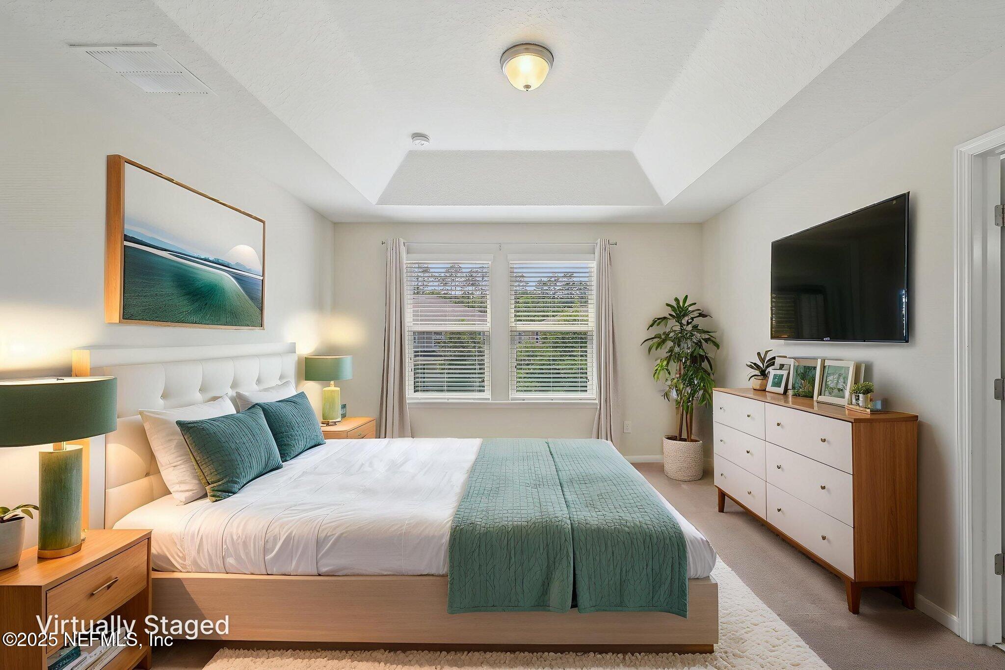 53 Nelson Lane St. Johns, FL 32259 - Photo 19 of 37 a bedroom with a bed and a flat screen tv