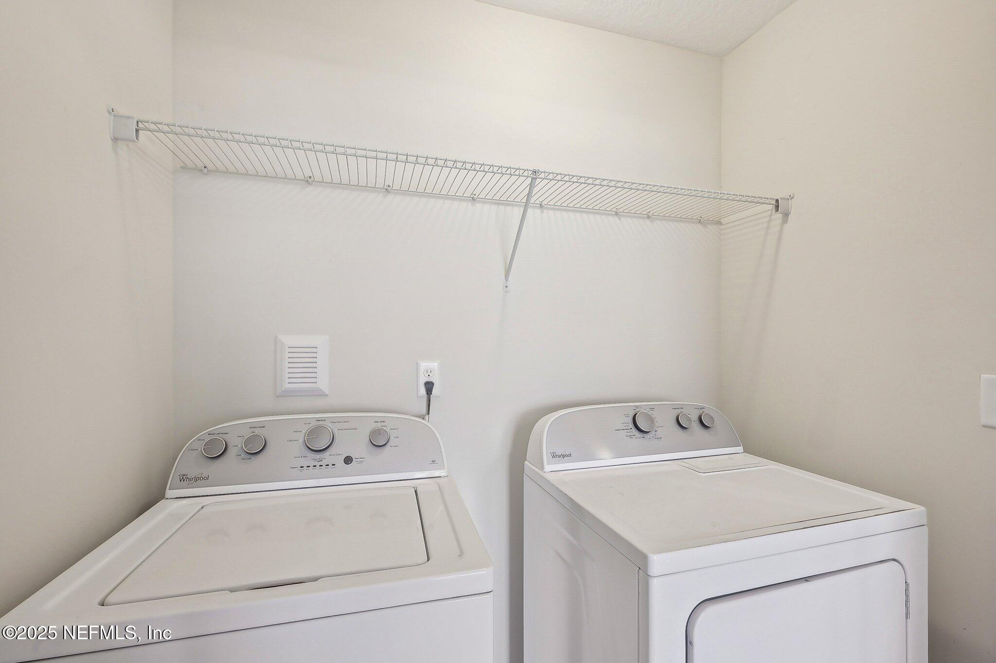 53 Nelson Lane St. Johns, FL 32259 - Photo 26 of 37 a utility room with dryer and washer