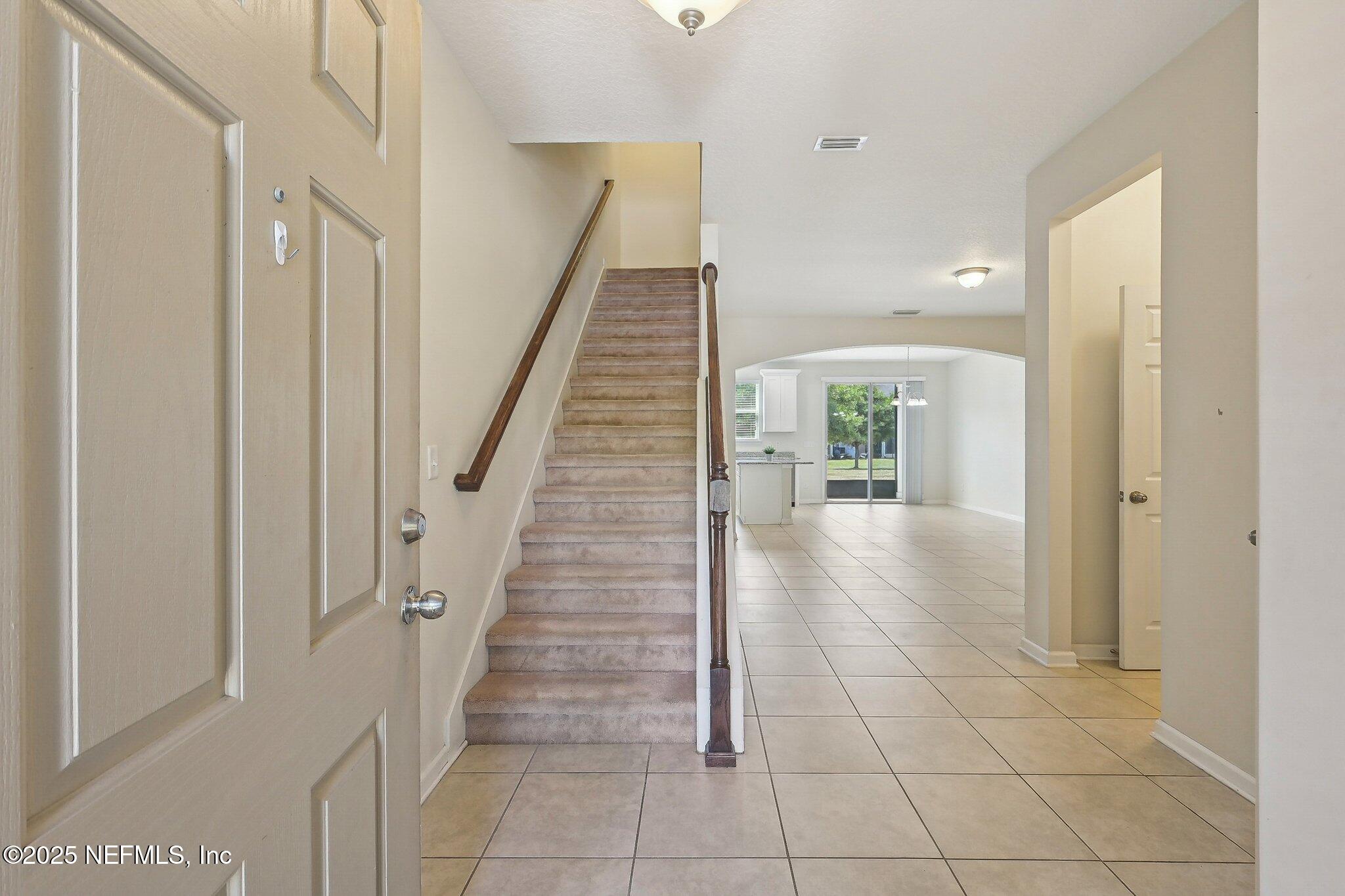 53 Nelson Lane St. Johns, FL 32259 - Photo 5 of 37 a view of entryway and hall with a window