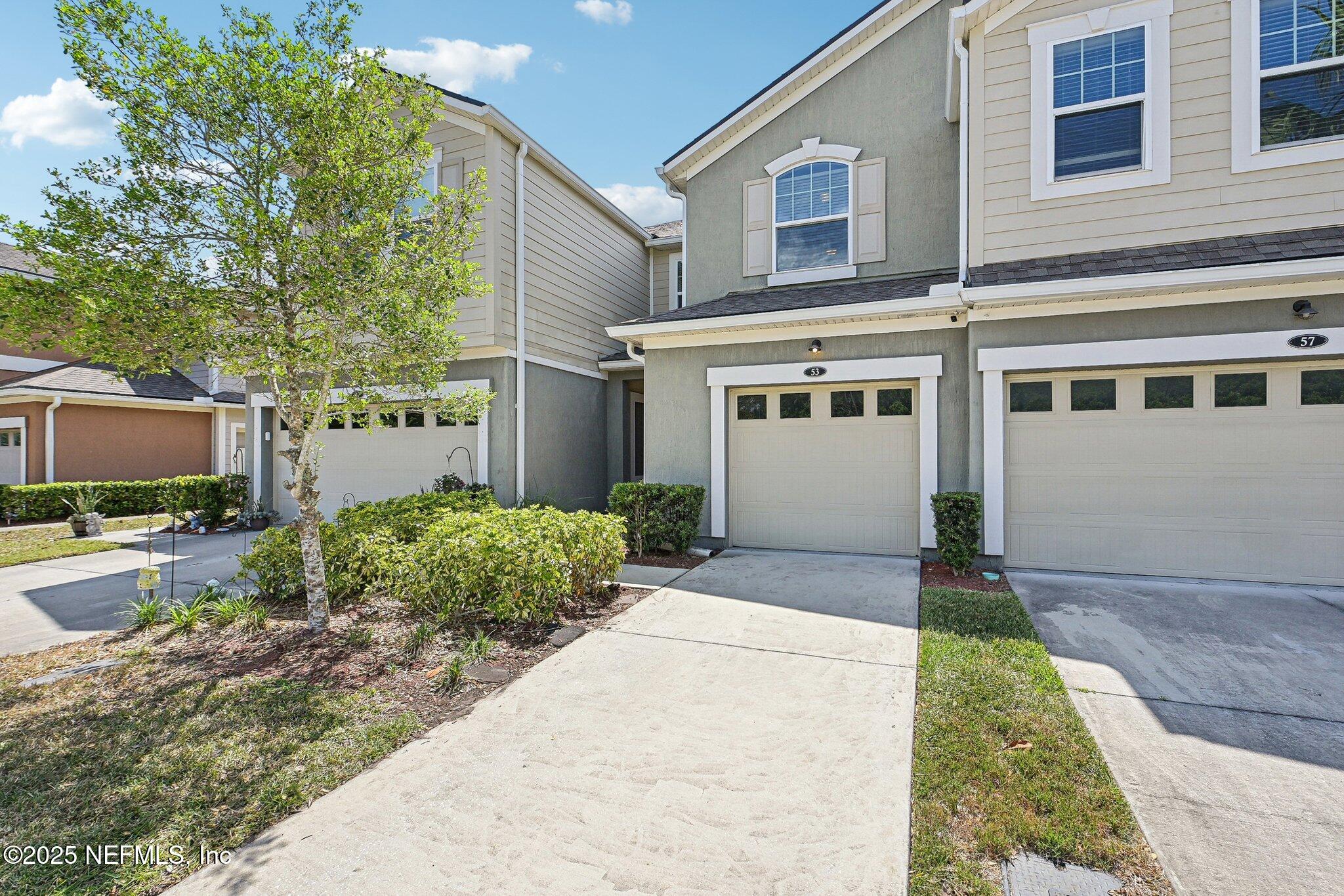 53 Nelson Lane St. Johns, FL 32259 - Photo 7 of 37 a front view of a house with garden